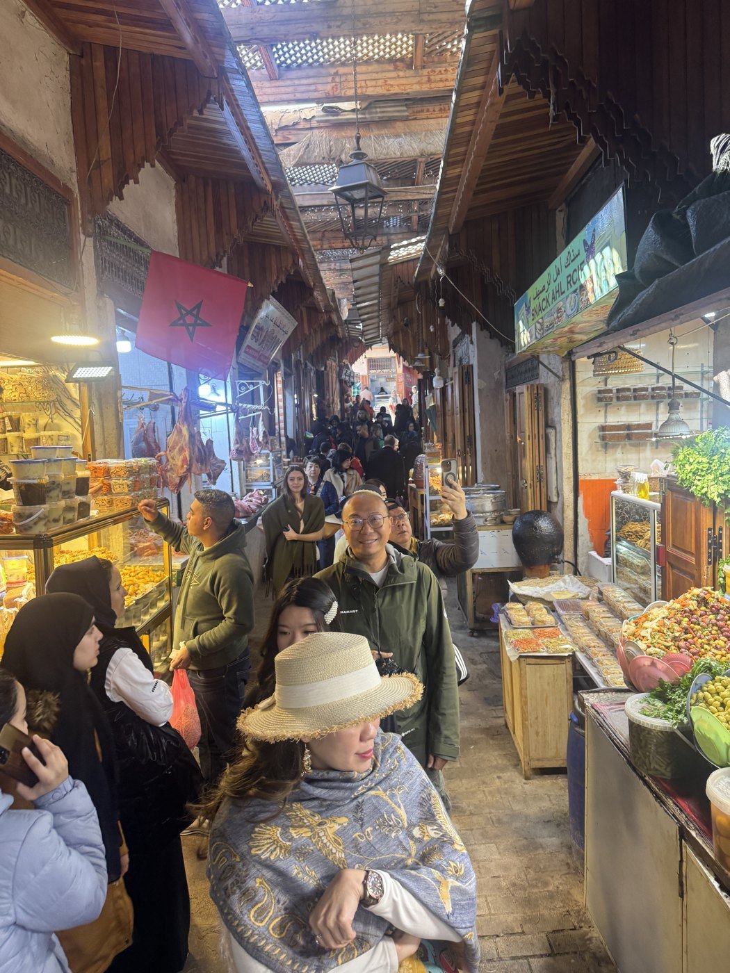 Guests walking through a covered souk during a private Fes Medina tour