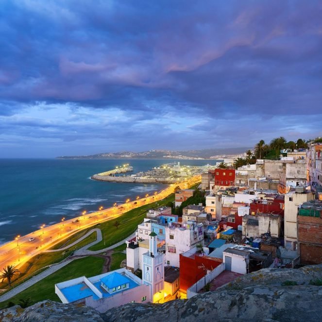 An aerial view of cityscape Tangier surrounded by buildings and water